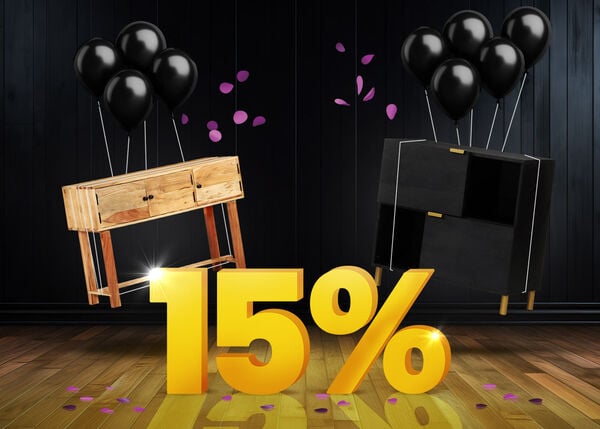 Wooden console table and black storage cabinet with black balloons in front of a bright yellow 15% sign on a dark wooden floor.