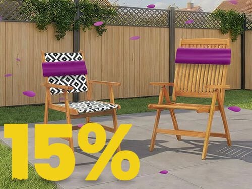 Wooden outdoor garden chairs on a sunny patio with decorative cushions, set against a wooden fence and flowers, featuring a 15% spring promotion banner.