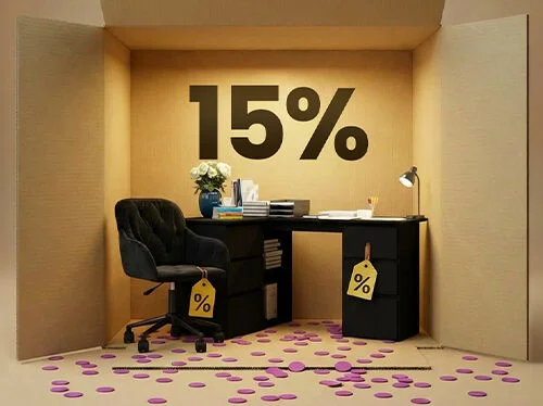 Home office furniture with a black desk, black drawer unit and black office chair styled in a box scene, showcasing a 15% discount on office furniture.
