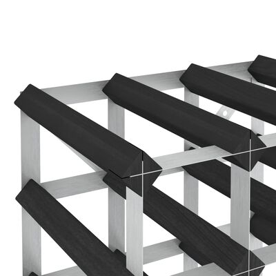 Close-up of the edge of a wine rack showing black angled shelf slats and silver frame.