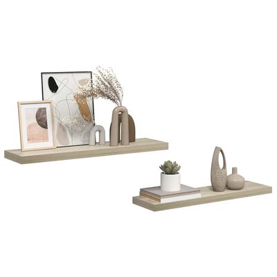 Two floating shelves with decor such as frames, vases, and books