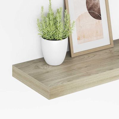Close-up of a rectangular wooden shelf with a plant leaning against its edge