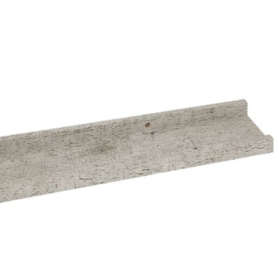 Close-up of edge of gray concrete-like shelf showing lip and rough texture