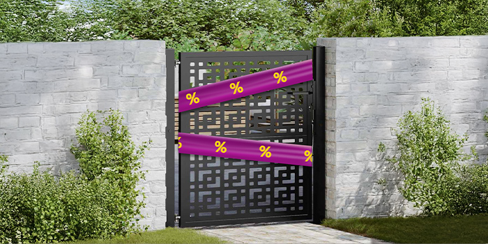 Brick garden fence with a black iron gate wrapped in a purple promotional band with yellow discount icons. Click to see the products in the offer.