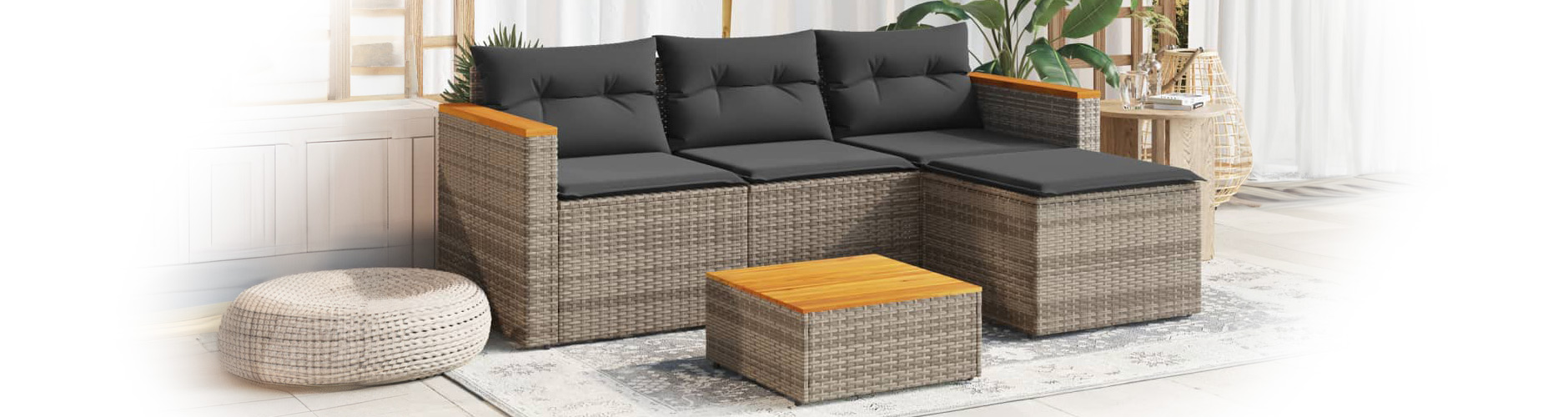 Rattan 3-piece sofa set with cushions and coffee table for outdoor use. Click to shop the collection.