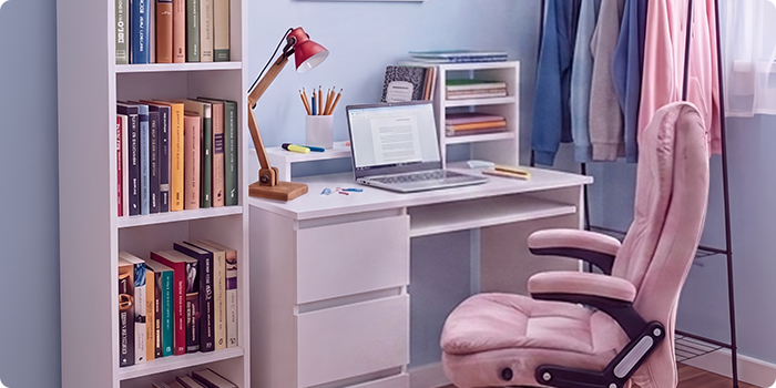Modern student study space with a white desk, ergonomic office chair, laptop, bookshelf, storage unit, and clothing rack in a bright, organized bedroom designed for comfortable studying and everyday student life.