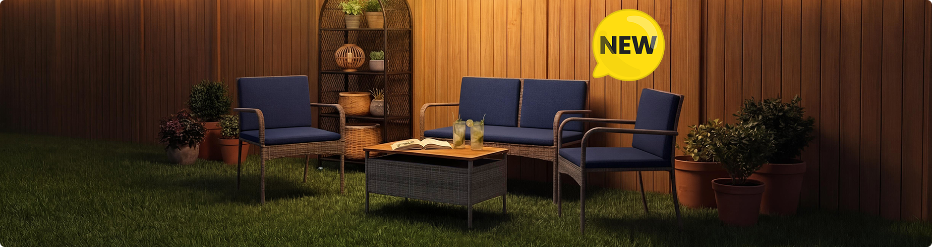 New rattan garden furniture set with navy blue cushions including a loveseat, two armchairs and a storage coffee table on a lawn, NEW badge displayed 
