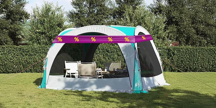 Tent in nature with table and chairs inside, wrapped in a purple promotional band with yellow discount icons. Click to see the products in the offer.